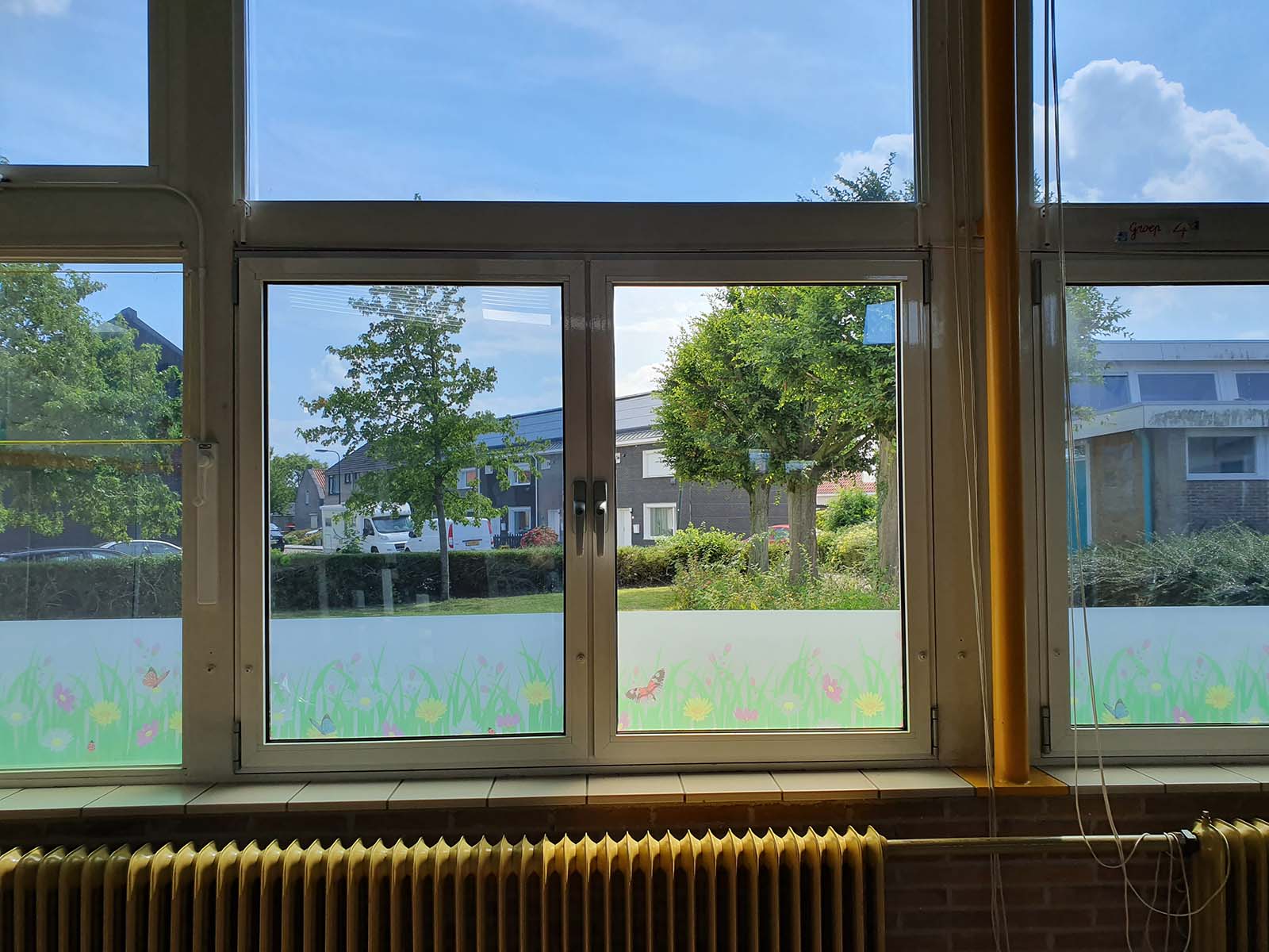 zonwerende en warmtewerende folie op school
